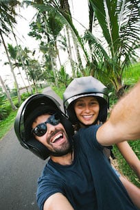 Benchmark Income Group Financial Freedom Couple Motorcycle Vacation Selfie